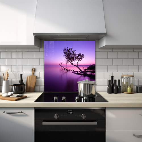 Tree growing out of a purple lake during sunset glass splashback.