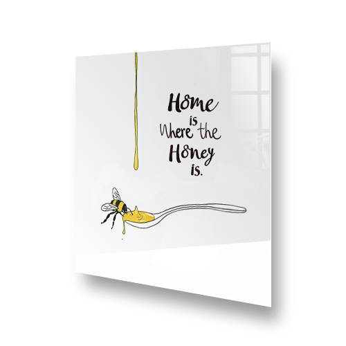 Modern white glass kitchen splashback with bee and honey design and "Home is Where the Honey is" script. Side View