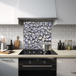 Top down view of hundreds of grey pebbles glass splashback. thumbnail