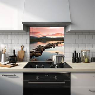 Rock pebbles on a lake with mountain and forest at sunset glass splashback. thumbnail