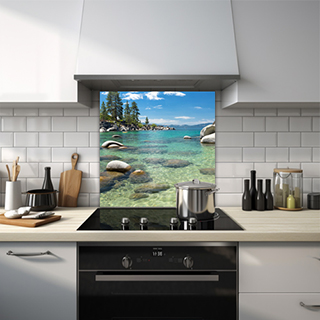 Clear lake on a sunny day with rocks and forest glass splashback. thumbnail