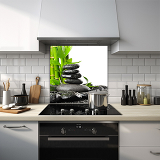 4 stacked black pebbles with water droplets glass splashback. thumbnail