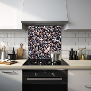 Looking down on hundreds of wet brown pebbles glass splashback. thumbnail