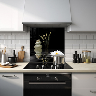 Water scene with white flower and stacked pebbles in a zen garden glass splashback. thumbnail