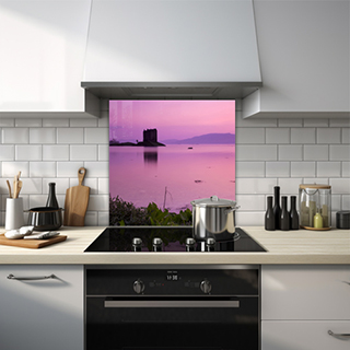 Glass splashback of Castle Stalker during sunrise with a purple sky. thumbnail