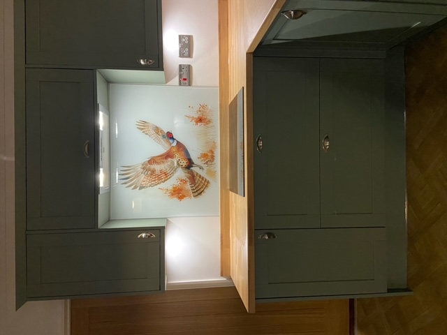 Flying Pheasant splashback behind induction hob